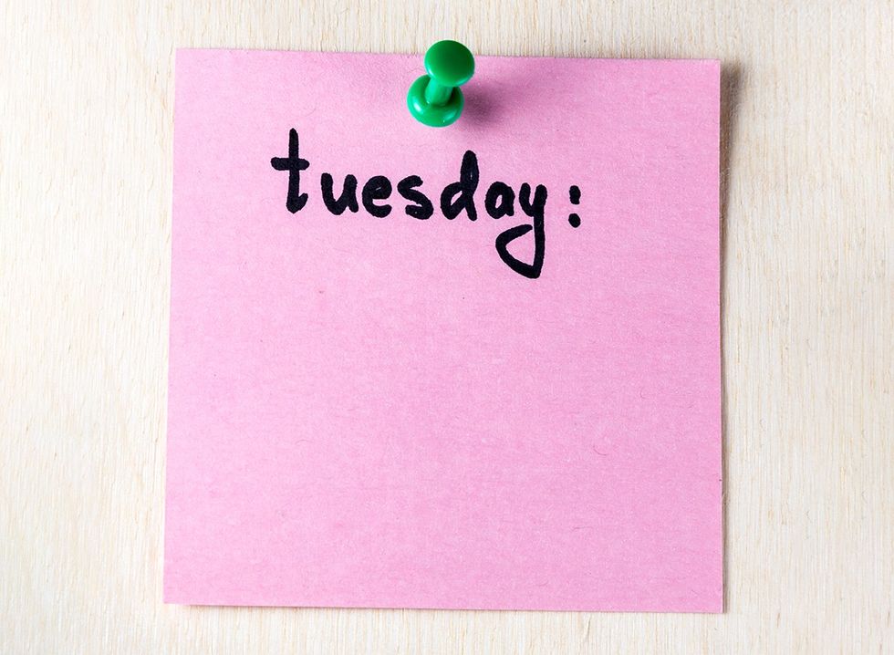 The word 'Tuesday' written on a post-it note