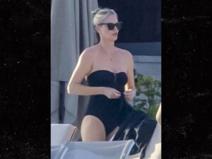 Charlize Theron was spotted on a Mexican beach with her mother Gerda and daughter August as she gears up to celebrate the New Year.