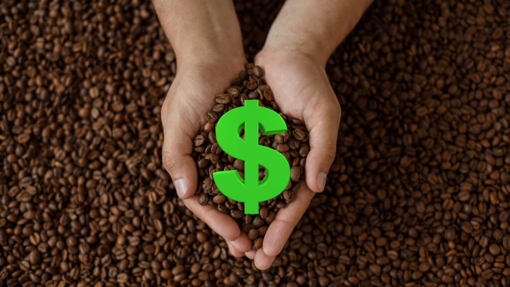 person holding coffee beans and a money sign