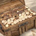 buried treasure chest full of gold coins in the sand