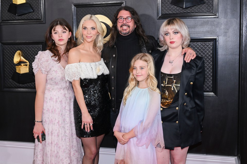 Dave Grohl and Jordyn Blum seen with their daughters Violet, Ophelia and Harper at the 65th Annual GRAMMY Awards in 2023