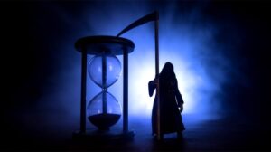 Silhouette of Hourglass clock and Grim Reaper