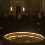 Sister Valya (Jessica Barden) sitting among other Bene Gesserit sisters in a still from Dune Prophecy