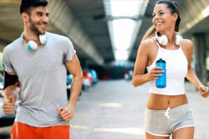 A happy couple running together