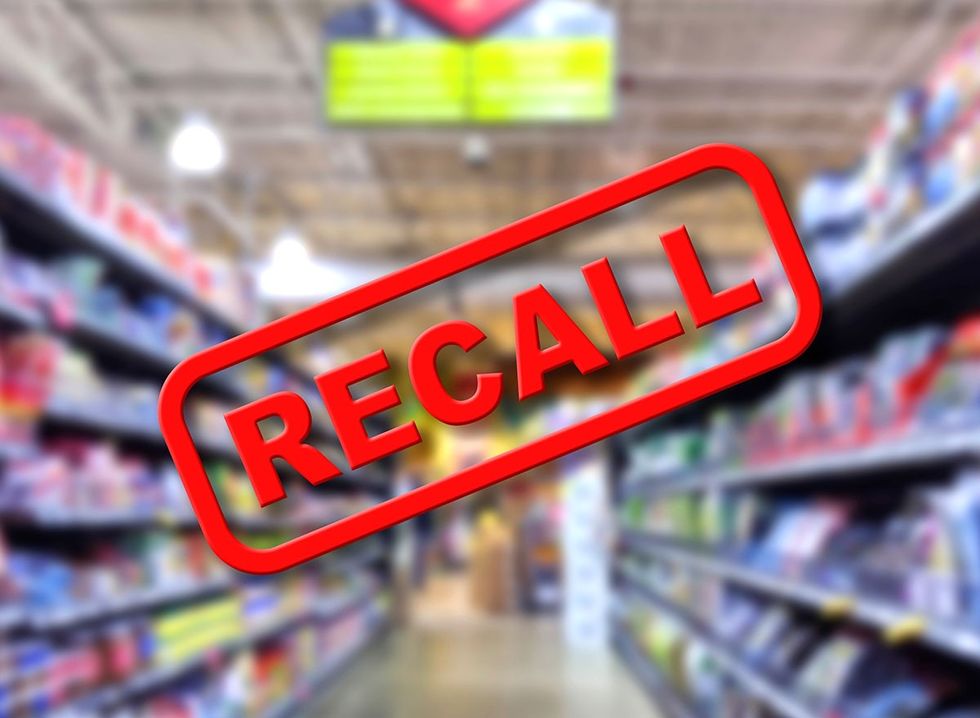 The word 'recall' imposed over an image of a grocery store