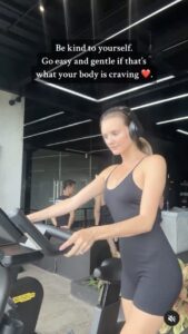 Nikki Smart is seen using a stationary bike.