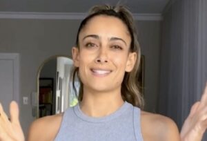 Fitness Influencer Shona Vertue in Two-Piece Workout Gear Demonstrates "Flexibility Work"