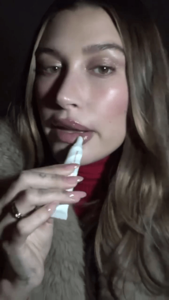 Hailey was seen applying her Rhode lip gloss in a short Instagram video