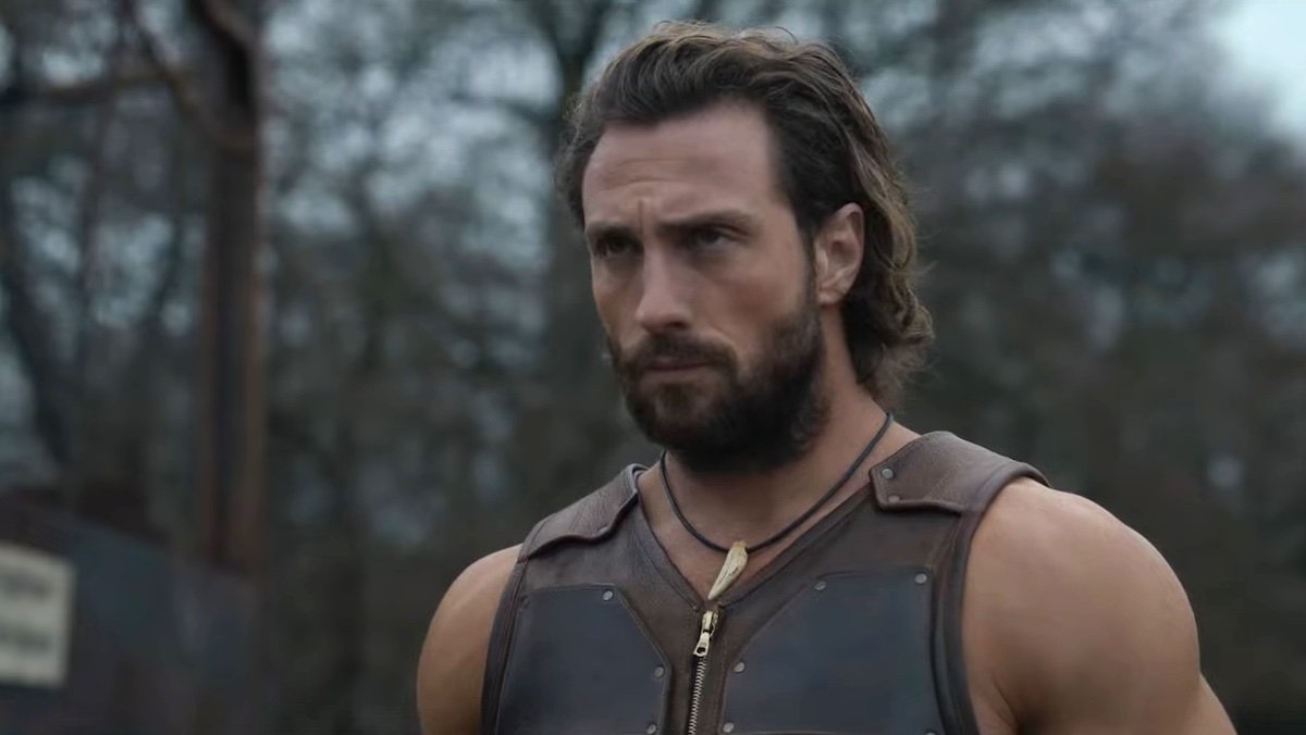 Aaron Taylor-Johnson outside in the woods as Kraven the Hunter