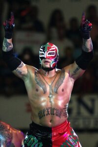 Wrestling fighter Rey Misterio raises his arms at the ring during  the WWE Smackdown wrestling function at Plaza Monumental Monterrey on October 15, 2009 in Monterrey, Mexico.