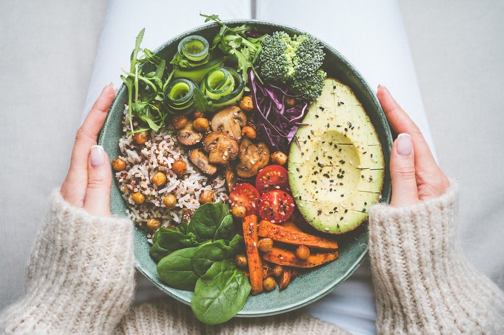 Woman,Holding,Plate,With,Vegan,Or,Vegetarian,Food.,Healthy,Plant