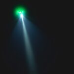 green UFO shines light