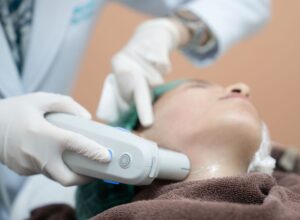 Ultrasound therapy treatment for skin tightening in clinic