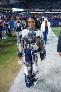 Simone Biles attended Thursday's Seattle Seahawks vs. Chicago Bears game in an outfit splashed with images of her husband, Bears safety Jonathan Owens.