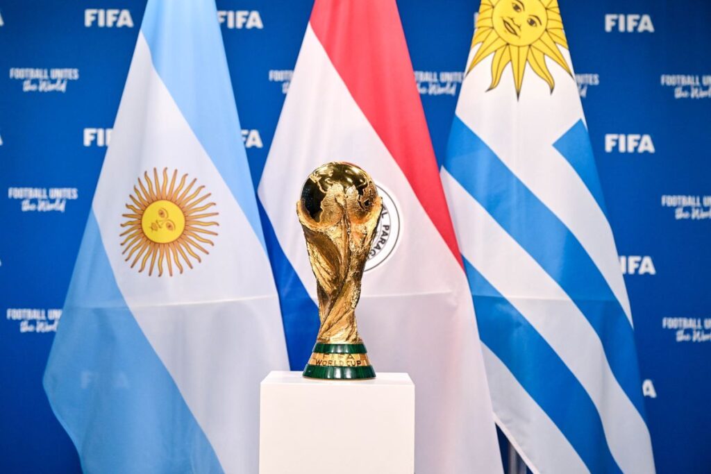 ZURICH, SWITZERLAND - DECEMBER 11: A view of the FIFA World Cup Winner's Trophy with the flags of the hosts of the matches of the FIFA World Cup 2030 Centenary Celebration Uruguay, Argentina and Paraguay during a trophy shoot at the Home of FIFA on December 11, 2024 in Zurich, Switzerland. (Photo by Harold Cunningham - FIFA/FIFA via Getty Images)