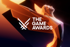 Graphic of The Game Awards trophy, a winged woman stretching her wings behind her head against a black and gold background.