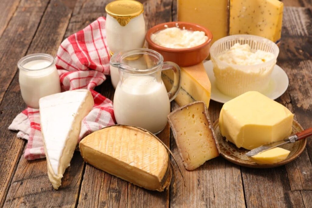 Dairy and cheeses on a wooden surface