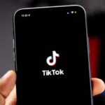 TikTok logo on phone screen