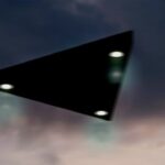 Triangular shaped ufo flying in the sky