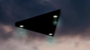 Triangular shaped ufo flying in the sky