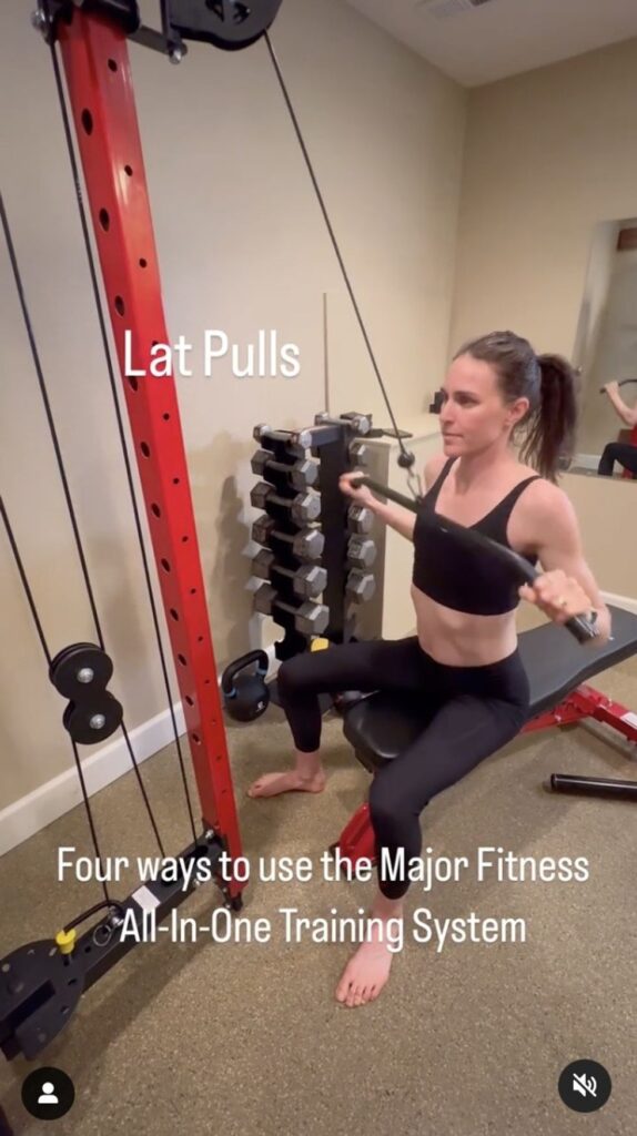 Gwen Jorgensen is seen doing lateral pulldowns.