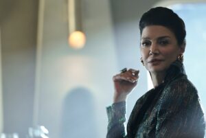 Shohreh Aghdashloo, as Chrisjen Avasarala from The Expanse, faces the camera and smiles