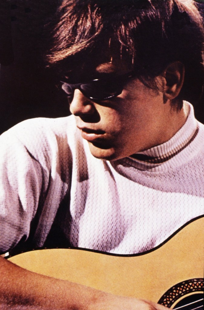 Singer-songwriter José Feliciano playing guitar