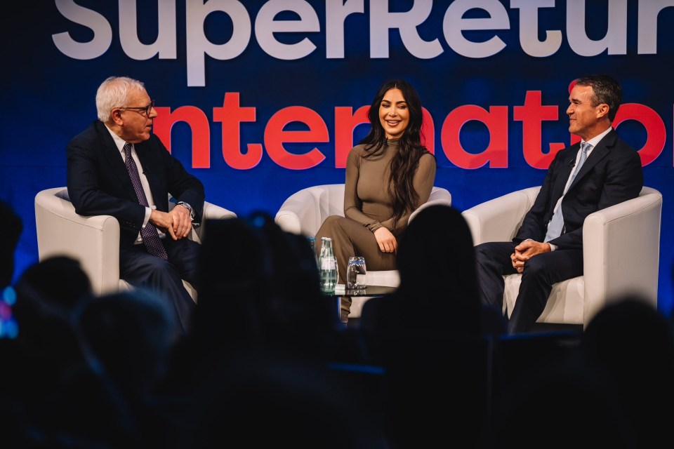 Kim speaks on stage with Jay Sammons and industry titan, David Rubenstein