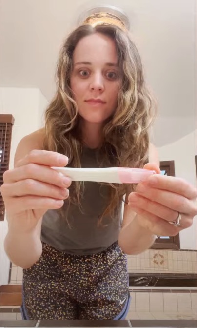 Jinger looked shocked as she held a positive pregnancy test before telling her husband Jeremy the big news