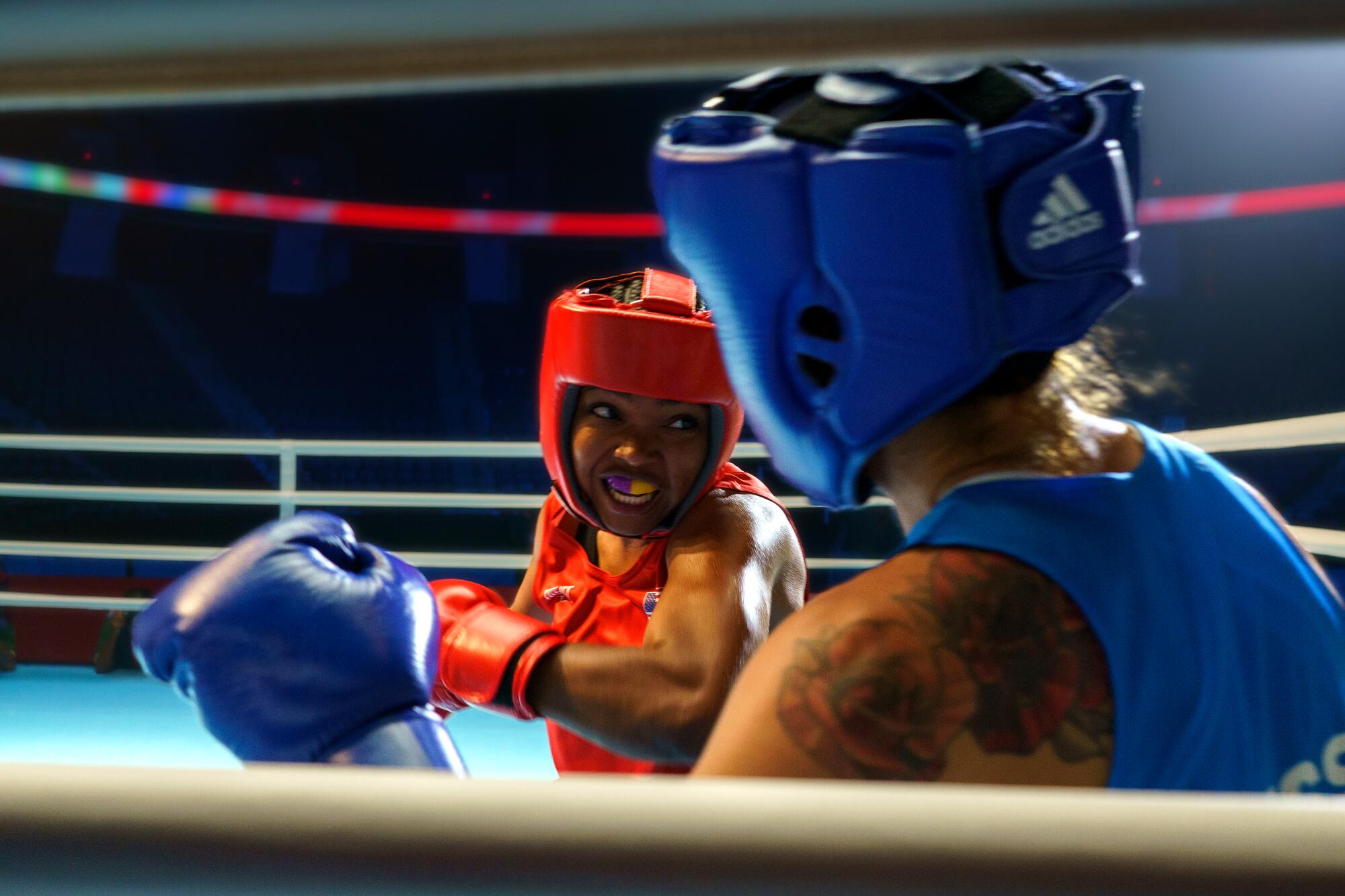 Two women boxing in a scene from "The Fire Inside."