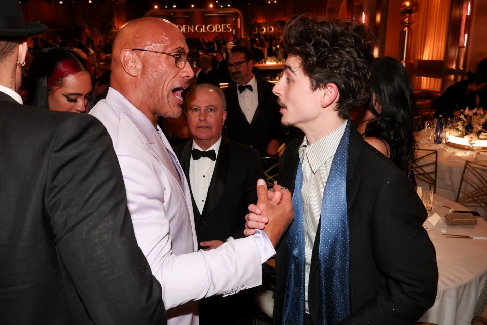 Dwayne Johnson greets Timothée Chalamet at the 82nd Annual Golden Globes