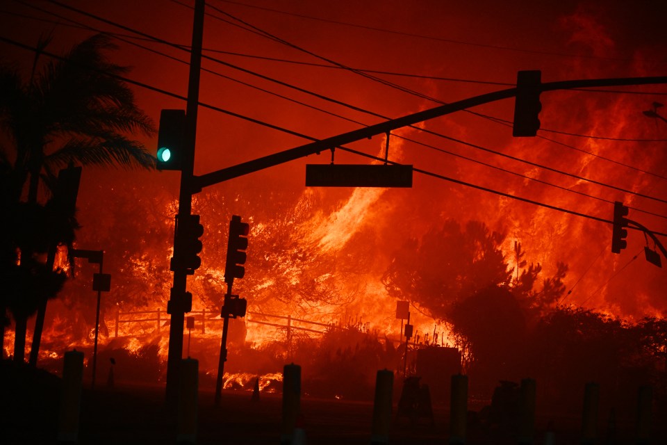 Flames overtake the intersection of Temescal Canyon and Pacific Coast Highway