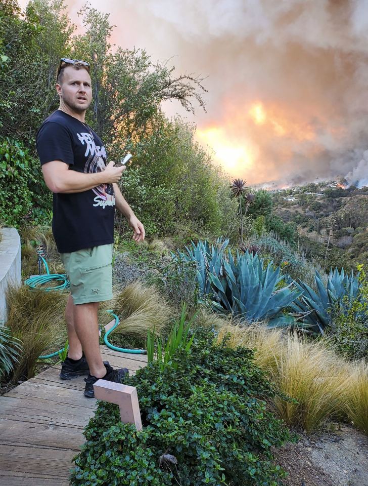 Spencer Pratt reacts to watching the fire which burned down his home