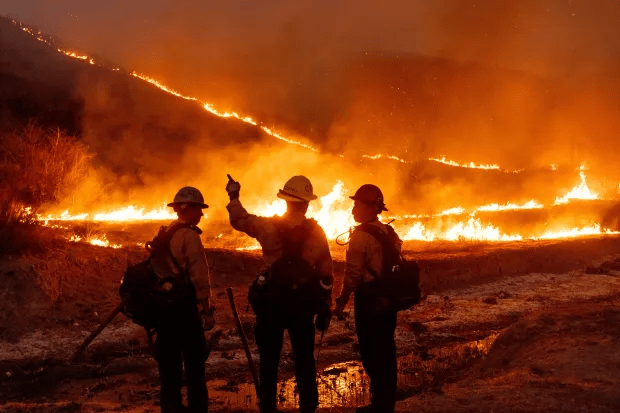 Fire crews battle the Kenneth Fire in the West Hills section of Los Angeles