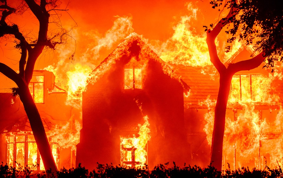 A home is engulfed in flames during the Eaton fire