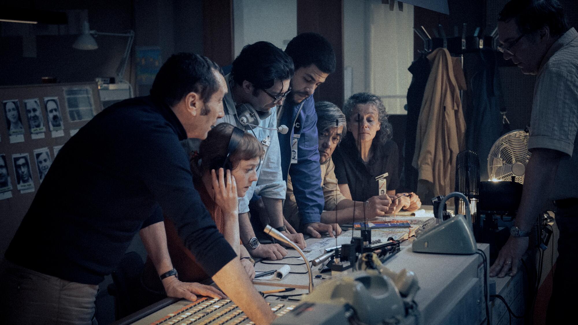 A group of people work in a television control booth in "September 5."