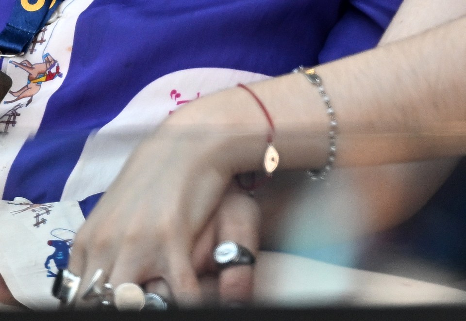 Close-up of Ava Eliot Jackman's hands and wrists, showing jewelry.