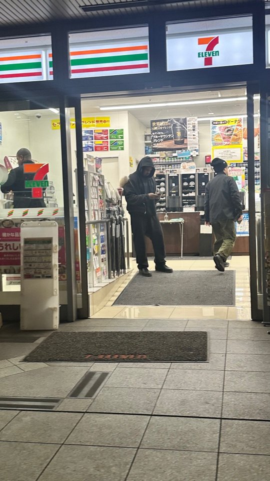 Kanye West leaving a 7-Eleven in Japan with his children.