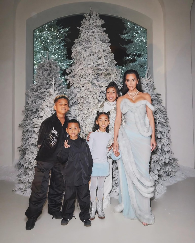 Kim Kardashian with her four children at a Christmas Eve party.