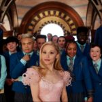 Ariana Granda as Glinda stands at the head of a group of classmates in "Wicked."