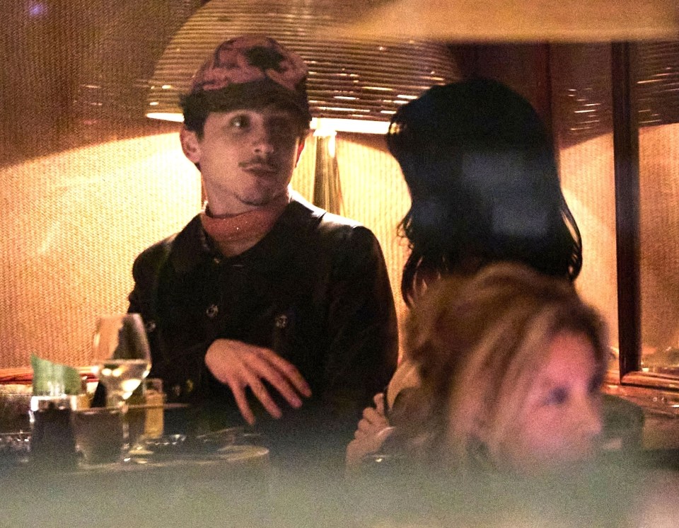 Timothée Chalamet and Kylie Jenner at a restaurant.