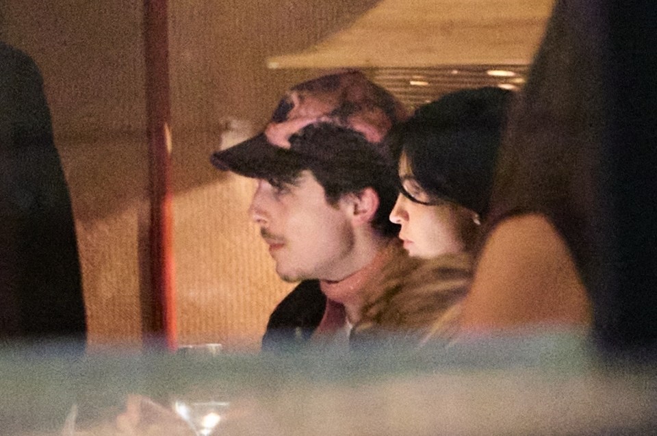 Timothée Chalamet and Kylie Jenner at a restaurant.