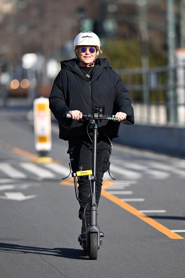 Deborra-Lee Furness riding an e-scooter in New York City.