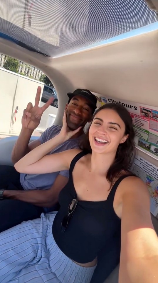 Matt James and Rachael Kirkconnell in a vehicle, smiling for a selfie.