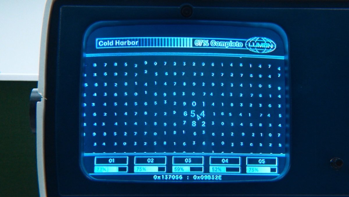 A blue computer screen with random numbers on Severance