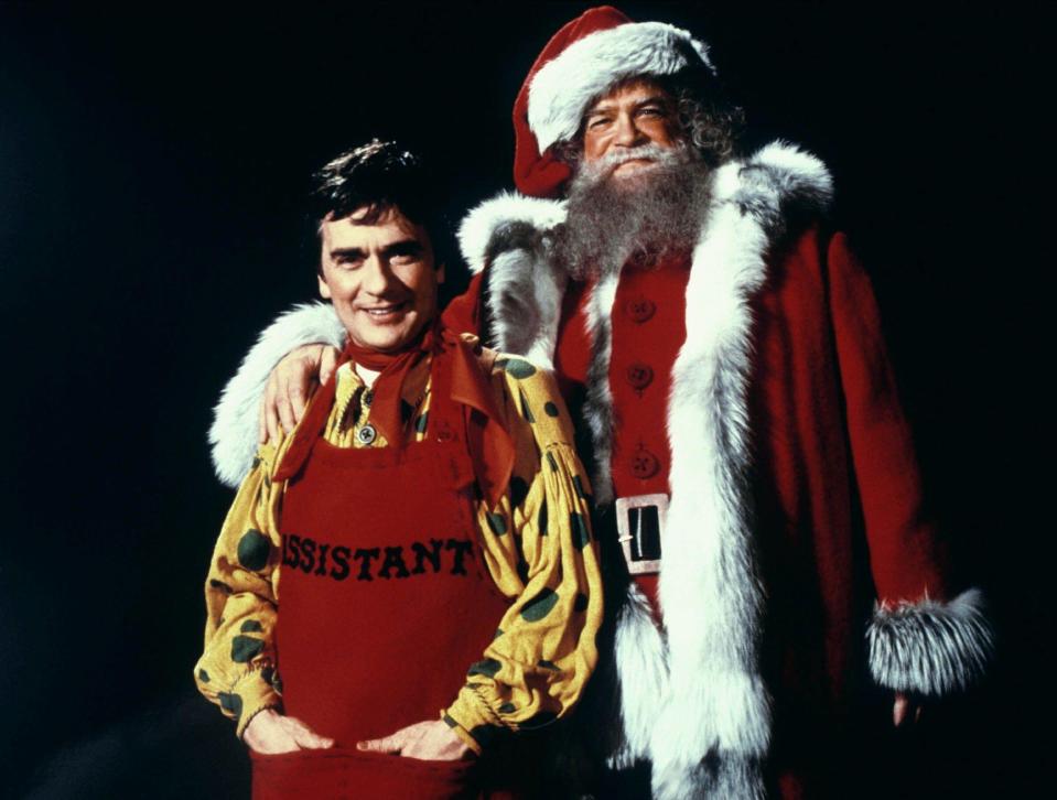 Santa Claus and his assistant.