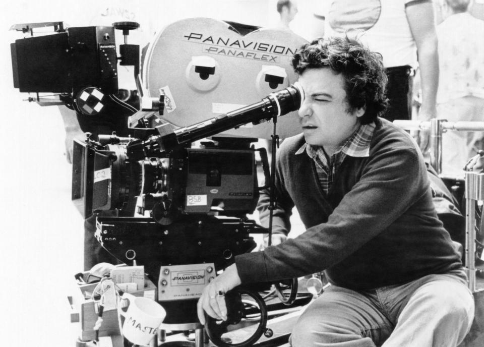 Jeannot Szwarc, director of Somewhere in Time, looking through a movie camera.