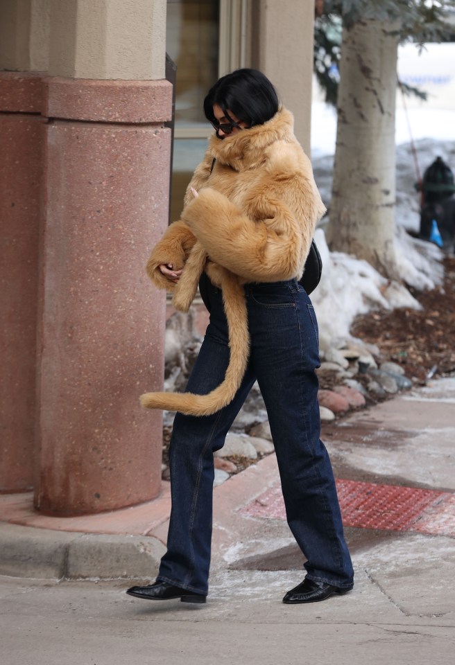 Kylie Jenner wearing a tan fur coat and jeans in Aspen, Colorado.