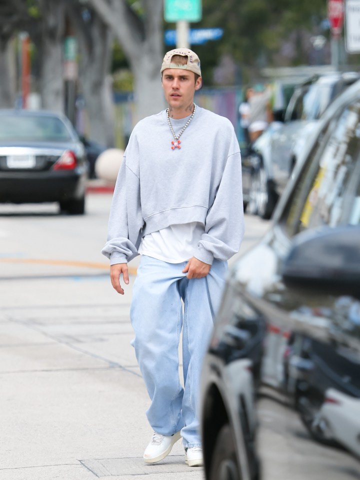 Justin Bieber walking down the street.