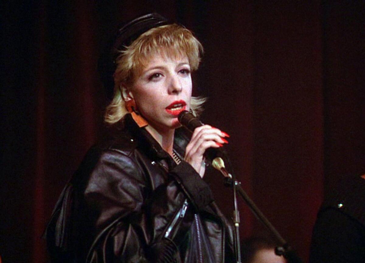 Julee Cruise sings into a microphone on "Twin Peaks."